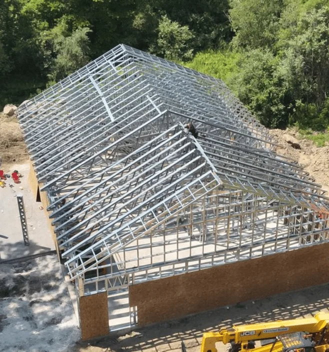 Aerial view of steel frame barndominium construction in Alabama